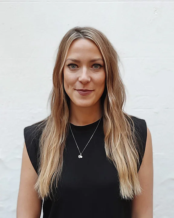 Scandinavian Girl Wearing Black Dress and Small Necklace