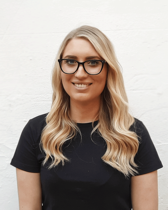 Smiling Blonde Girl With Glasses